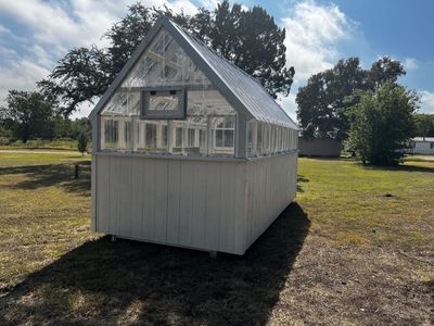 Gray greenhouse: With an opening gable vent.