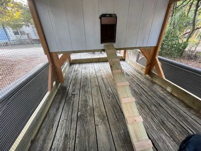 Auto door and ramp: The automatic door opens onto a cleated ramp down to the run.