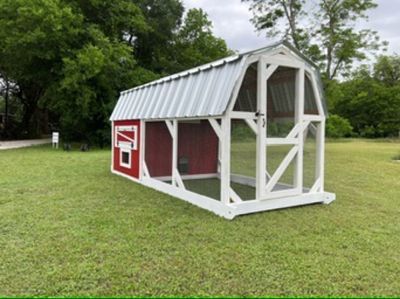 Red coop with white timber-frame run